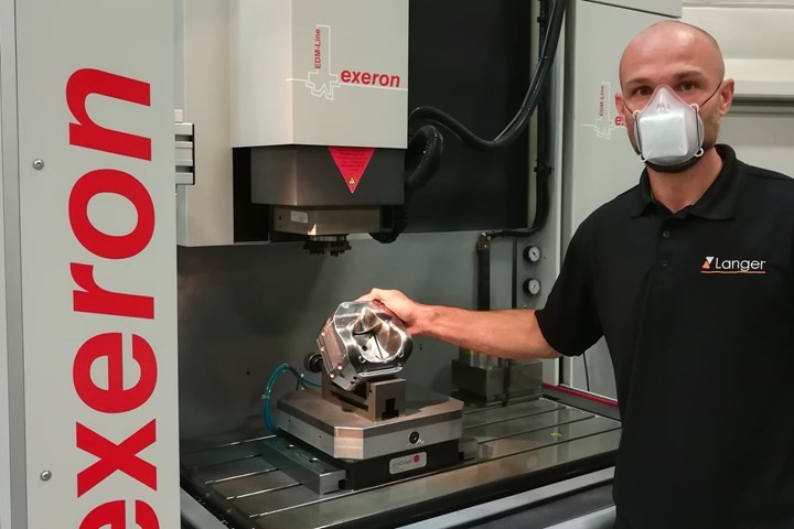 Robert Kühn shows the finished mold cavity on an Exeron die-sinking EDM machine. Robert Kühn shows the finished mold cavity on an Exeron die-sinking EDM machine.